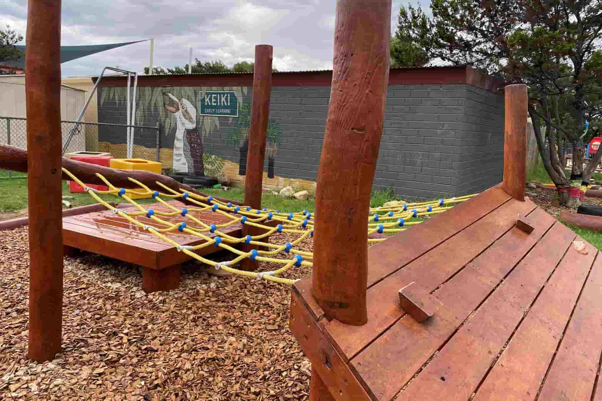 wooden playground structure outdoors