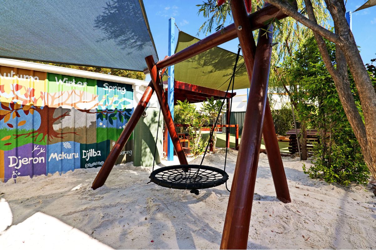 childcare garden with swing at mindarie keys early learning centre